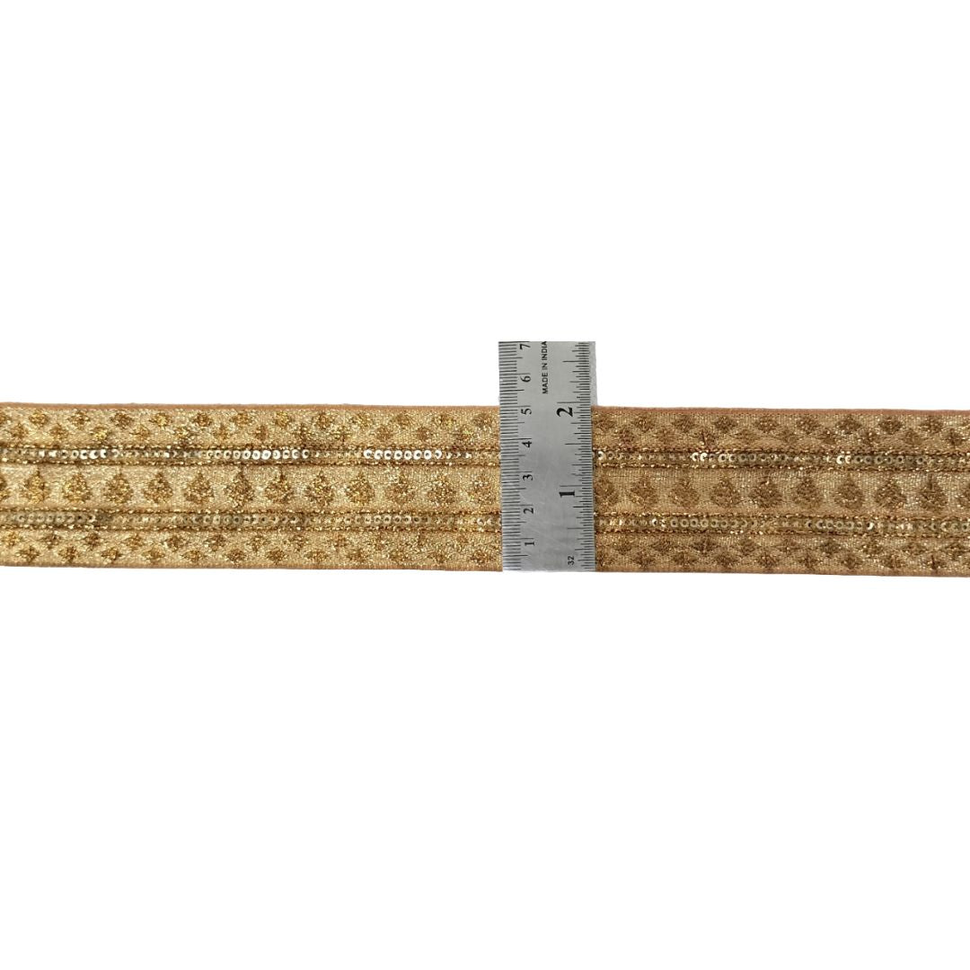 Patterned ribbon with a ruler for scale on a white background